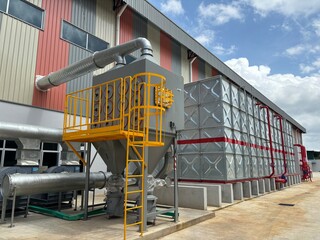 Industrial dust collector system and blower fans installed outside factory for air filtration and...