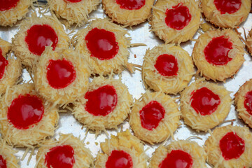 Baking Thumbprint Cookies with Red Jam and Shredded Coconut