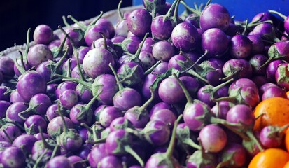Heap of Purple Eggplants at a Farmers Market