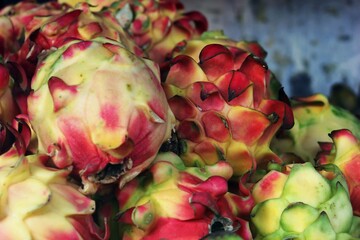 Dragon Fruit Pile: Exotic Tropical Produce Close-Up