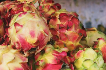 Dragon Fruit Pile: Exotic Produce Close-Up