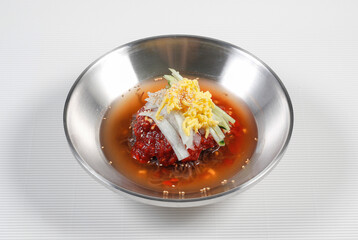 Cold Buckwheat Noodles (Korean cool noodles) decorated on thet marble table.