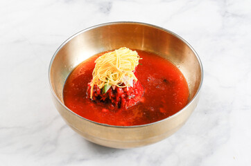 Cold Buckwheat Noodles (Korean cool noodles) decorated on thet marble table.