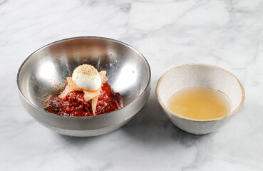 Cold Buckwheat Noodles (Korean cool noodles) decorated on thet marble table.