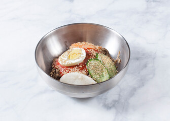 Cold Buckwheat Noodles (Korean cool noodles) decorated on thet marble table.