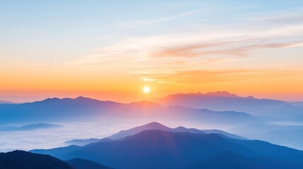 Obraz premium A stunning sunrise illuminating mountain peaks with gentle clouds, creating a serene and breathtaking natural view.