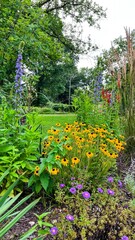 Diverse Garden Bed with Colorful Summer Blooms