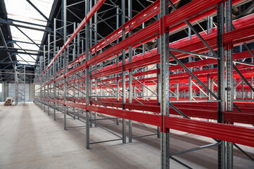 Logistics warehouse concept with empty high pallet racks, shelving system