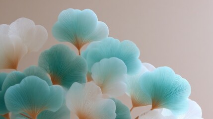 Close-up of translucent blue and white ginkgo leaves with soft lighting