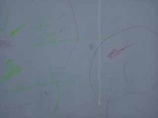 Childlike Crayon Drawings on Gray Wall Background
