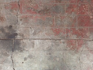Distressed Brick Wall with Faded Red Paint Texture