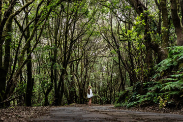Tourist walking in garajonay national park exploring la gomera, canary islands, spain