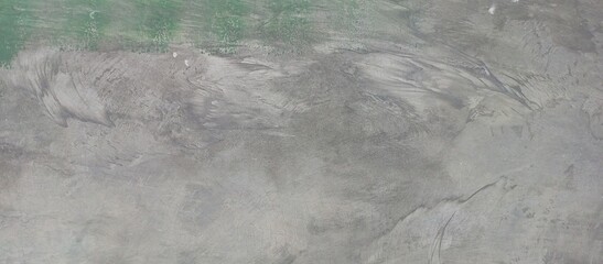 Rough Concrete Wall with Green and Gray Tones