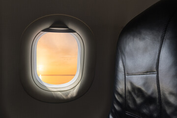 Window Plane and Seat Inside Airplane travel flying flight Backgrounds on sunset sky in the morning over ocean, Cabin Inside Plane trip passenger, nobody