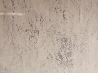 Worn Out White Surface with Dark Scratch Marks
