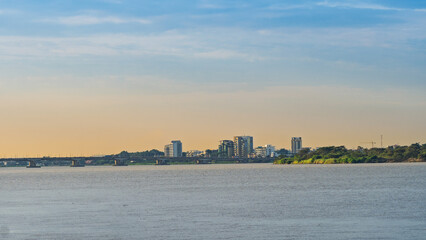 View of the Guayas River and the city of Samborondón at sunset from the boardwalk.