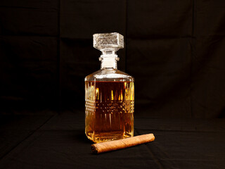 Elegant whiskey decanter and glass filled with amber liquor