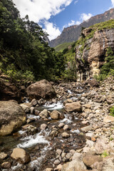 .The small upper flows of the Tugela River where it flows through the boulder strewn Tugela gorge in the Drakensberg mountains of South Africa.