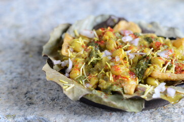 North Indian street food papdi matar chaat – crispy papdi topped with spicy white peas curry,...