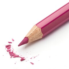 A close-up of a pink colored pencil with shavings scattered around it. The pencil has a sharpened tip and a wooden body.