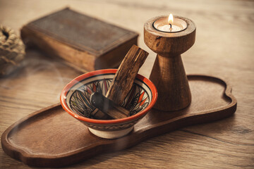 Burning Palo Santo and Candle on Wooden Tray for Relaxation and Meditation