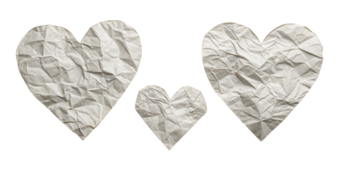 Crumpled paper hearts in various sizes create charming and artistic display, evoking feelings of love and creativity