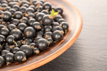 Sweet blackcurrant, macro, on slate stone.