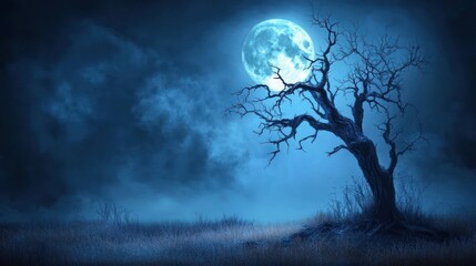Spooky moonlit dead tree