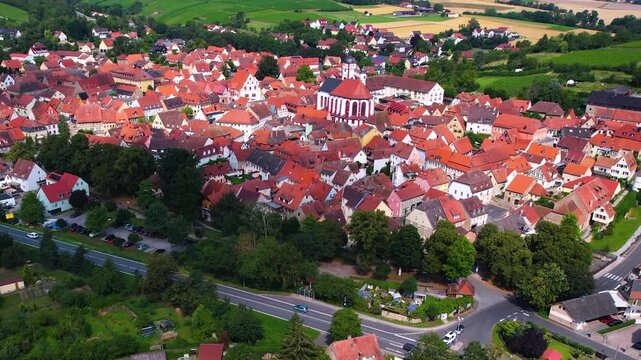 A panorama Aerial view around the old town of the city Dettelbach on an early summer day in Germany.	