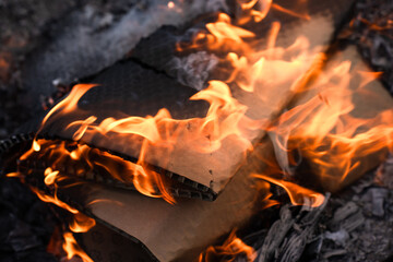 Burning  Paper Packaging in Flames and Ashes