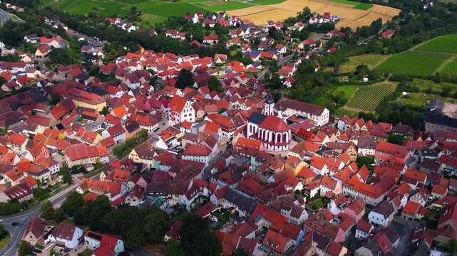 A panorama Aerial view around the old town of the city Dettelbach on an early summer day in Germany.	