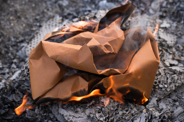 Burning  Paper Packaging in Flames and Ashes