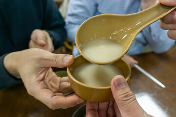 Rice Wine,Korean traditional liquor made from rice. Pouring makgeolli: traditional korean rice wine...