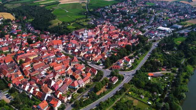 A panorama Aerial view around the old town of the city Dettelbach on an early summer day in Germany.	