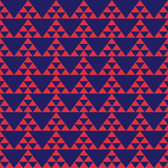 A fun and modern tribal design featuring pink geometric triangle motifs on a navy base. The repeat pattern is influenced by folk traditions with a contemporary twist, perfect for fashion or surface de