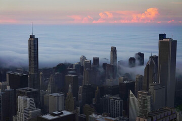 Fototapeta premium View from Willis Tower or Sears Building in Chicago with Fog Clouds Rolling in on the City Buildings