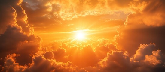 Fiery sunset clouds with a bright sun