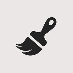 Simple black silhouette of a paintbrush with bristles on a light grey background