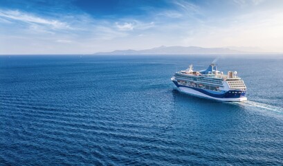 Panoramic aerial rear view of a cruise ship sailing over blue ocean with copy space as a banner for...