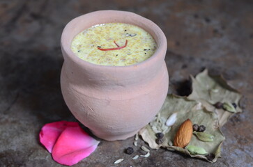 Traditional Indian drink thandai – chilled milk-based beverage infused with almonds, fennel seeds, cardamom, saffron, and rose petals – festive Holi and summer cooler