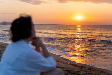 Meditative sunrise on tranquil beachfront