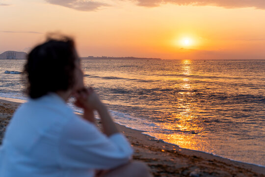 Meditative sunrise on tranquil beachfront