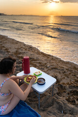 Meditating at sunrise on a serene beach
