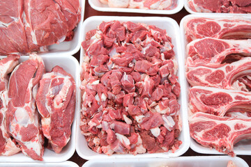 Fresh minced and sliced lamb meat on display. butcher counter meat arrangement.