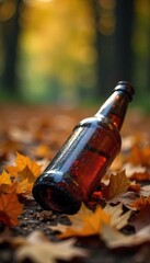 Discarded Beer Bottle Amidst Autumn Leaves A Poignant Symbol of Alcoholism and its Devastating Consequences