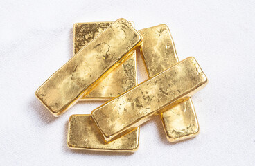 Pure ingots gold on the white background