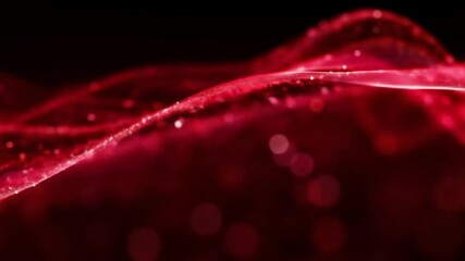 A close-up view of a dark red, rippling, liquid surface sprinkled with tiny, glittering particles. - Powered by Adobe