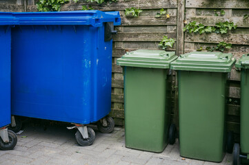 Colorful recycling bins on city street