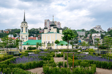 Voronezh, Russia, May 31, 2025: Assumption Admiralty Cathedral in summer in beautiful flower beds