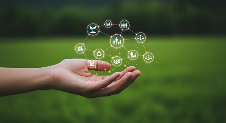 Human hand holding a network of icons representing sustainability and society